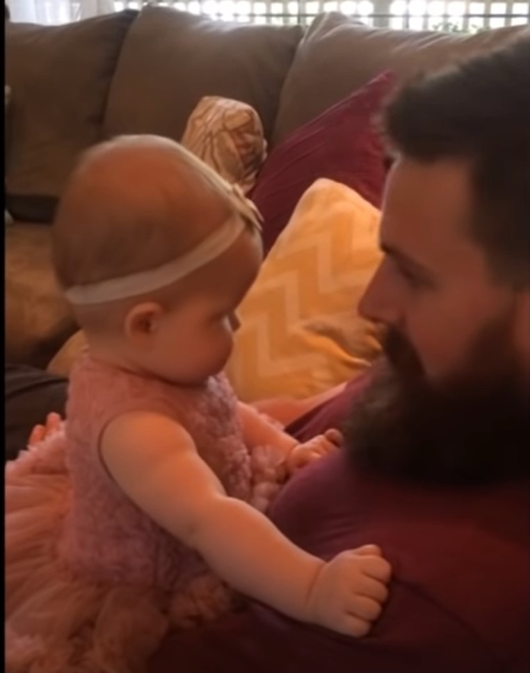 baby reacts daddys face